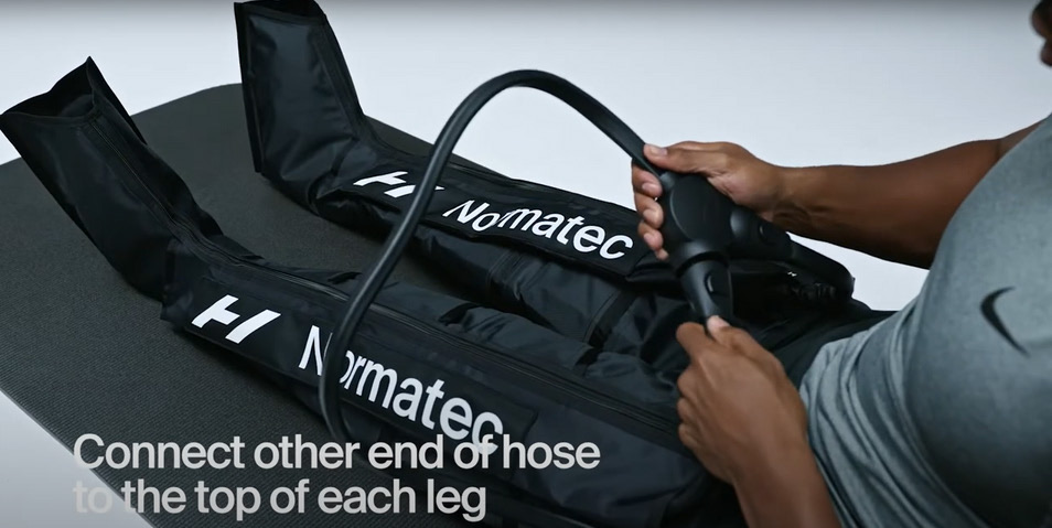 Connecting the other end of the hose to the top of each boot