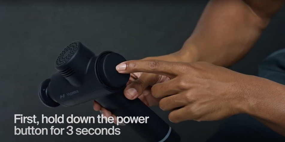Hold down the power button at the base of the handle for 3 seconds