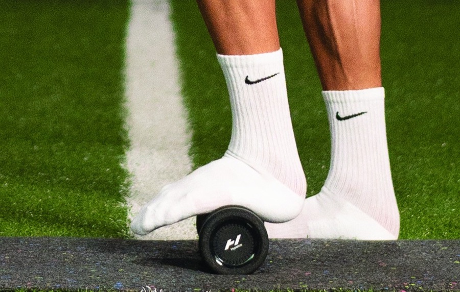 Standing on the Vyper roller to roll the feet